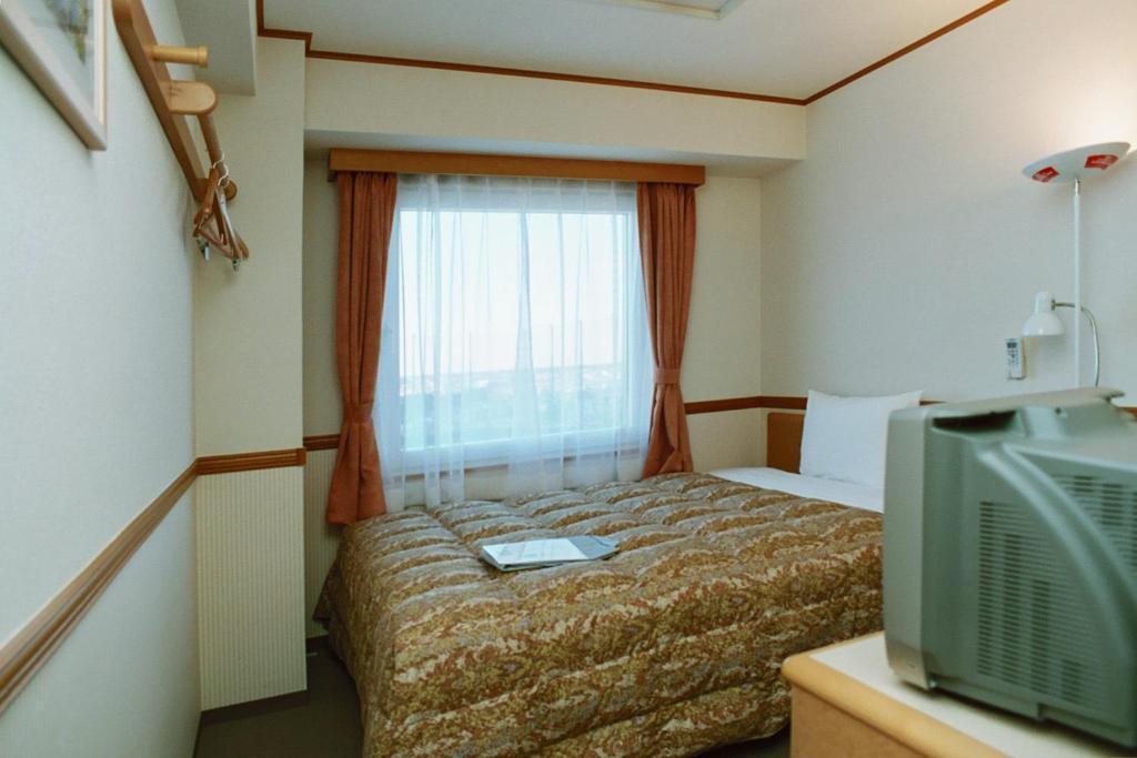 Toyoko Inn Saitama Shintoshin Rum bild